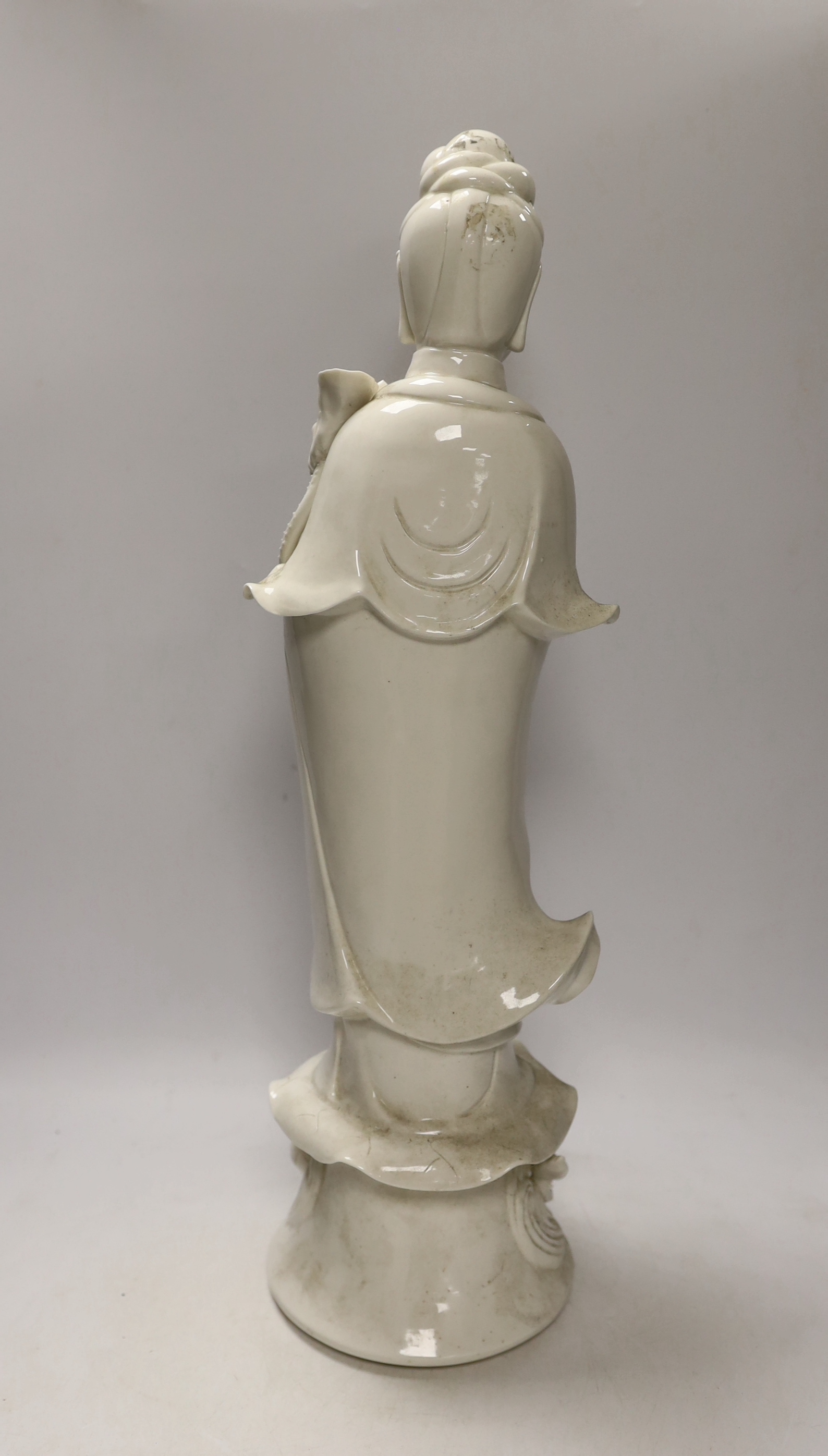 A large 20th century Chinese Blanc de Chine figure of Guanyin, 56cm